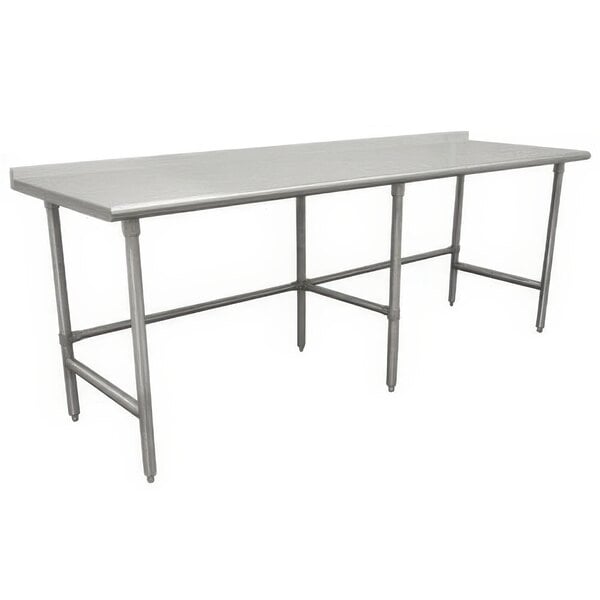 An Advance Tabco stainless steel work table with an open base and long top.