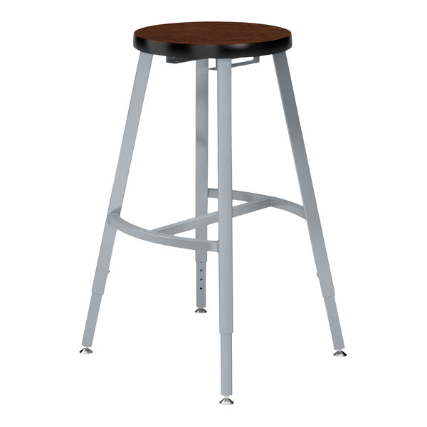 A National Public Seating Titan lab stool with a wooden seat.
