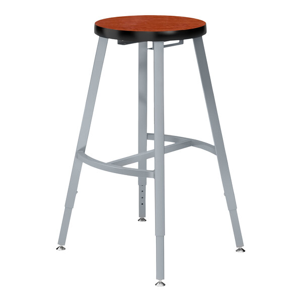 A National Public Seating Titan lab stool with a wood seat and metal legs.