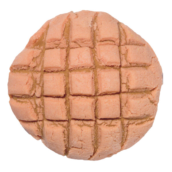 A peanut butter cookie with a waffle grid pattern on it.