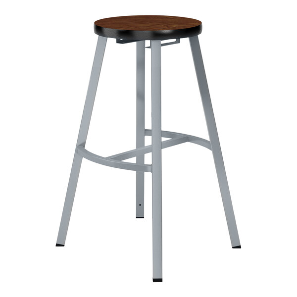 A National Public Seating Titan lab stool with a wooden seat.