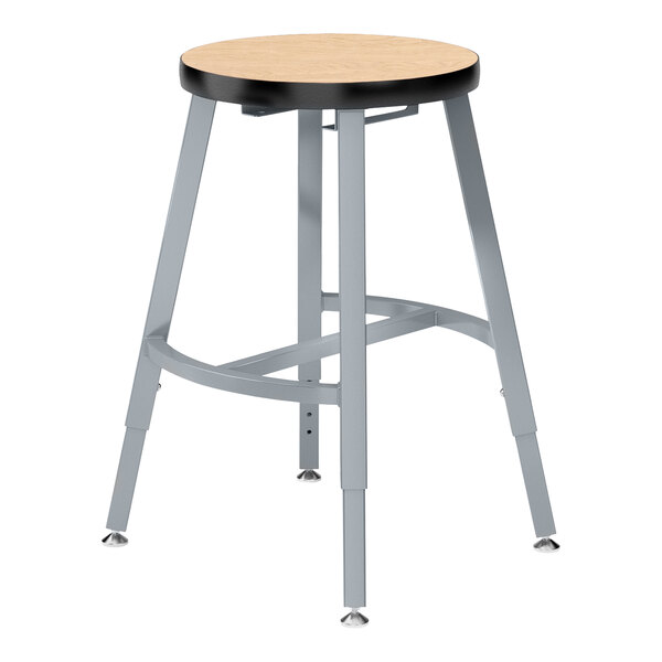 A National Public Seating lab stool with a gray steel frame and fusion maple seat.