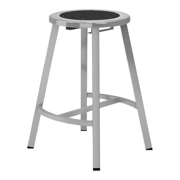 A gray metal National Public Seating lab stool with a black seat.