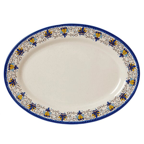 A white oval platter with blue and yellow designs.