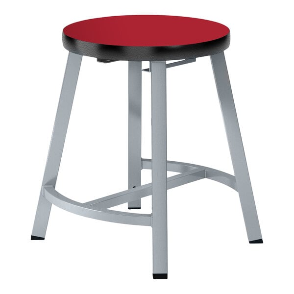 A red and silver National Public Seating lab stool with a hollyberry high-pressure laminate seat and steel base.