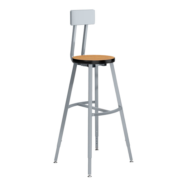 A National Public Seating lab stool with a Bannister Oak seat and backrest and a metal frame.