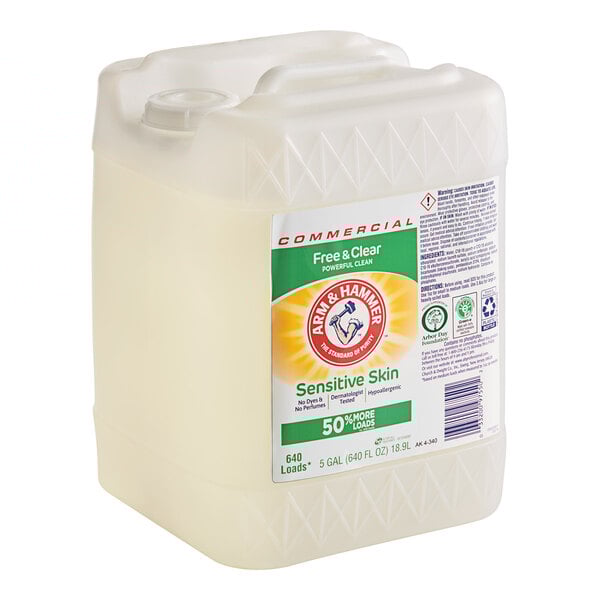 A white Arm & Hammer Free & Clear liquid laundry detergent container on a counter.