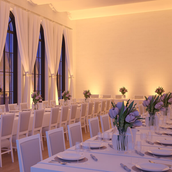 A room in a restaurant with tables set for dining, each with Ape Labs Maxi 2.0 LED lights.
