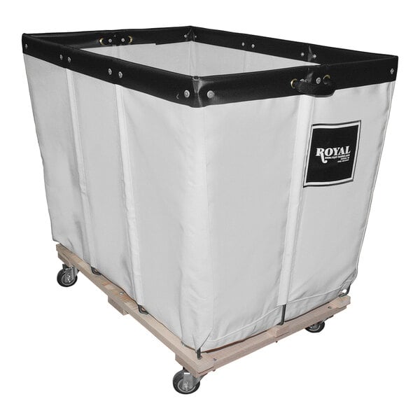 A large white Royal Basket Truck with a black interior on a wood cart.