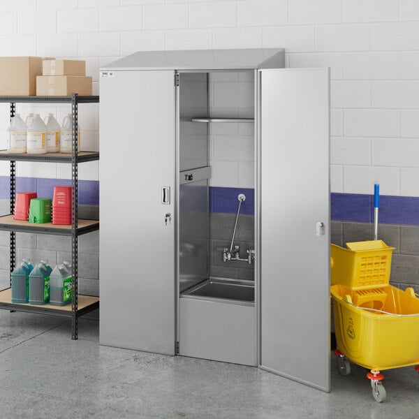 A Regency stainless steel mop sink cabinet with a mop sink on the right side.