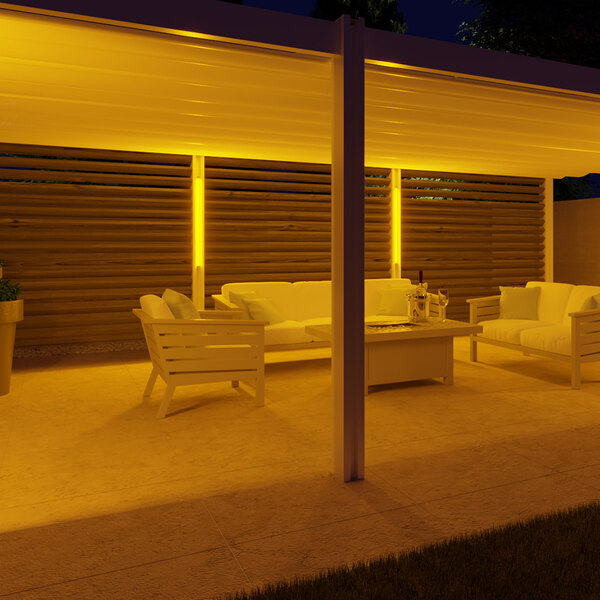 A patio with Ape Labs Stick 2.0 LED lights above a table and chairs.
