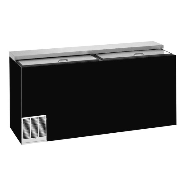 A black Perlick horizontal wine bottle cooler with a stainless steel top on a counter.