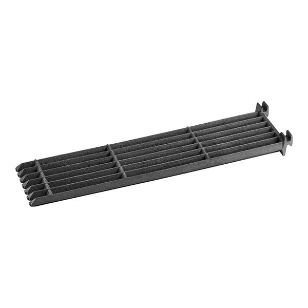 A black metal slanted grate with holes.