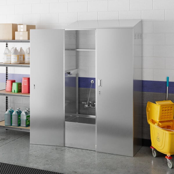 A Regency stainless steel mop sink cabinet with a mop sink on the left side.