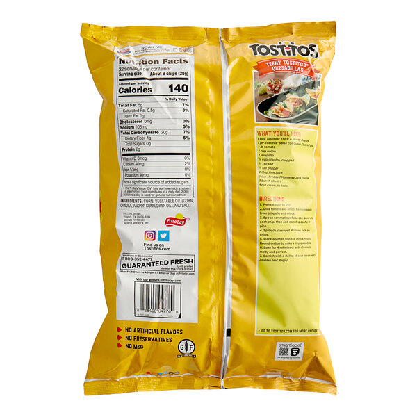 A yellow bag of Tostitos Thick & Hearty Rounds on a white background.