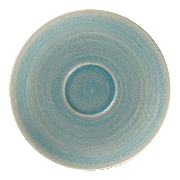 A close-up of a blue and white RAK Porcelain espresso cup saucer.