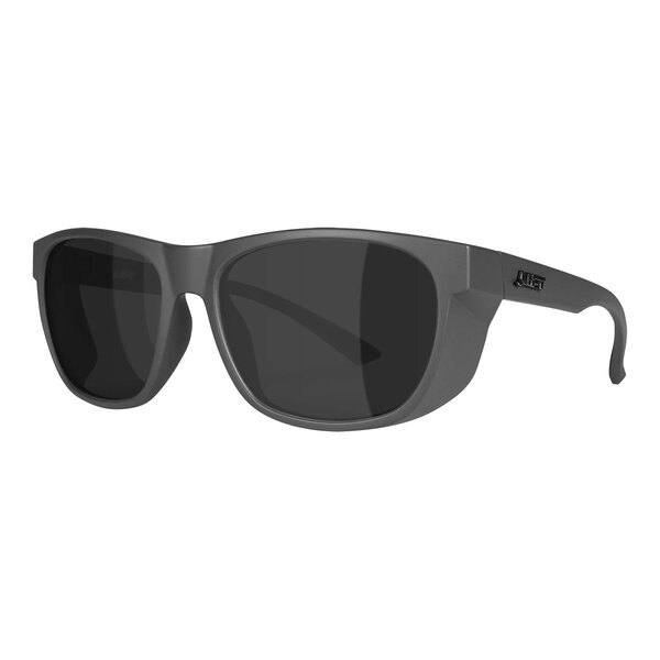 A close up of Lift Safety Tracker safety glasses with dark grey lenses.