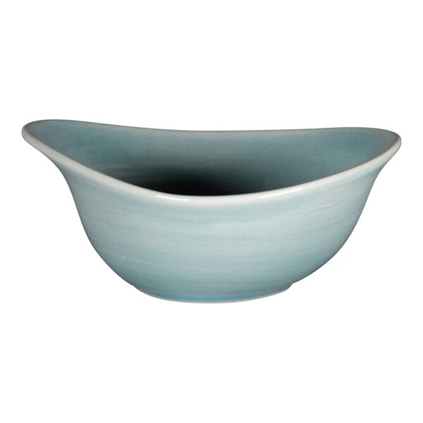 A close-up of a RAK Porcelain Sapphire blue bowl with a white interior.