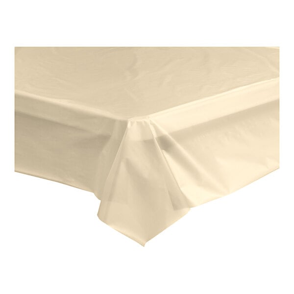 A close-up of a beige plastic table cover on a white surface.
