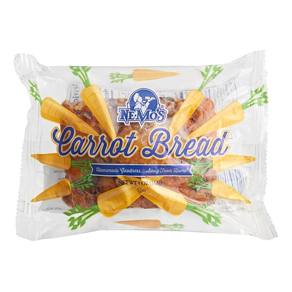 A plastic package of Ne-Mo's Bakery Carrot Cake Bread with yellow and green labeling.
