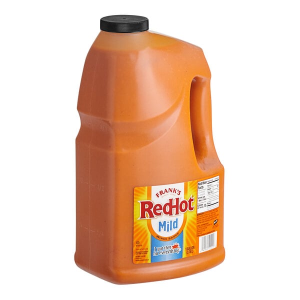 A jug of Frank's RedHot Mild Hot Sauce on a white background.