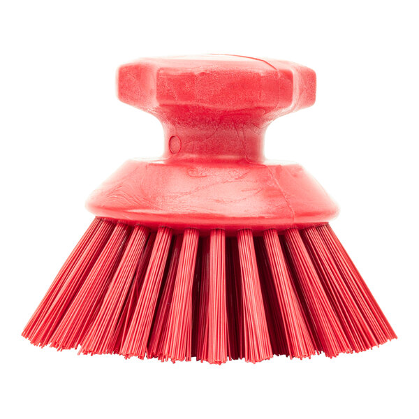 A red Carlisle Sparta round palm scrub brush with a round handle.