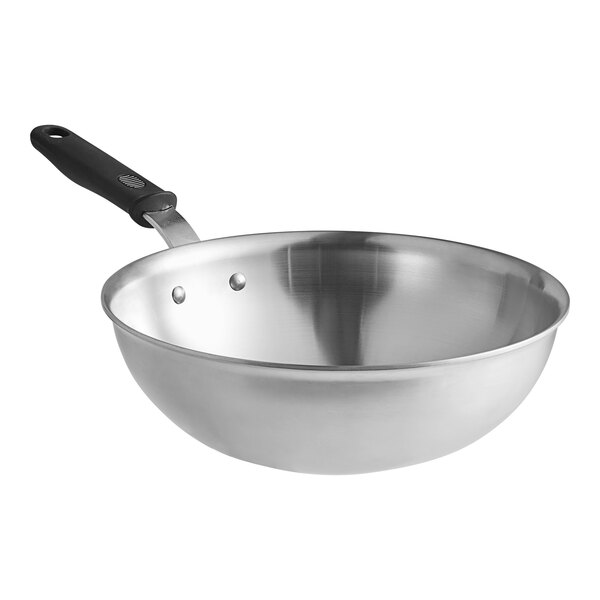 A Vollrath stainless steel stir fry pan with a black silicone handle.