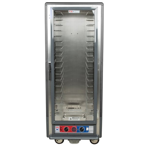 A gray Metro C5 heated holding and proofing cabinet with shelves.