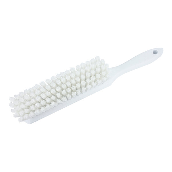 A Carlisle Sparta white counter brush with bristles.