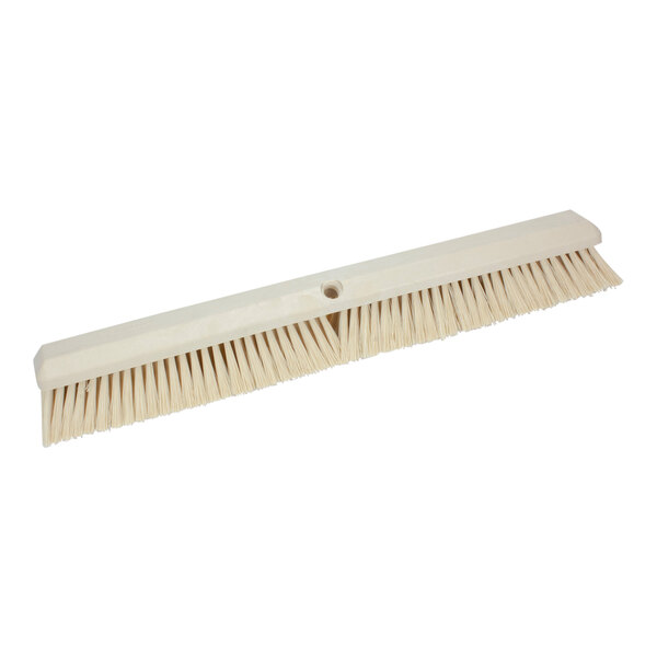 A white Carlisle Sparta push broom head with long bristles.