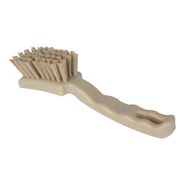 A Carlisle Sparta tan detail brush with bristles.