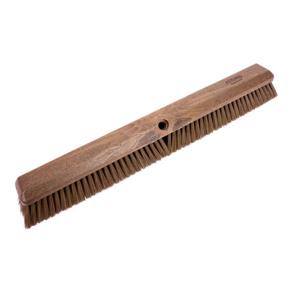 A Carlisle Sparta brown push broom head with bristles.