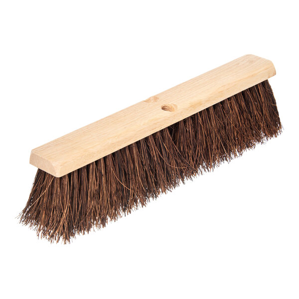 A Carlisle Flo-Pac hardwood broom head with Palmyra bristles and a wooden handle.