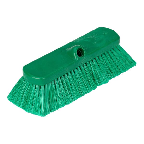 A green Carlisle Sparta deck brush with a handle.