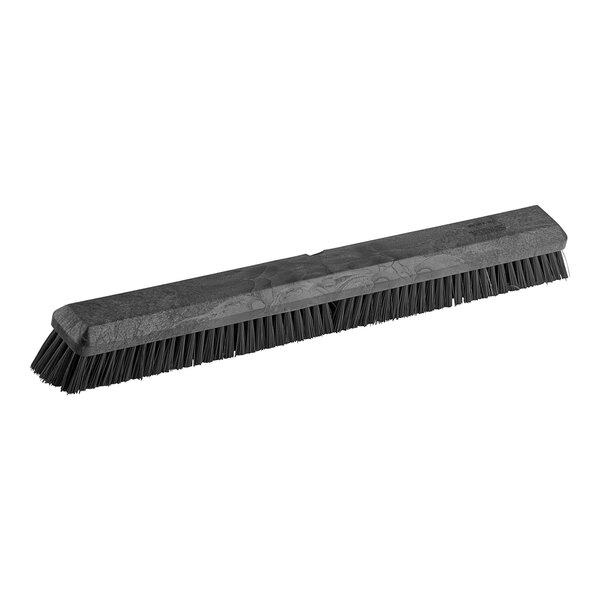 A black Carlisle Sparta push broom head with black bristles.