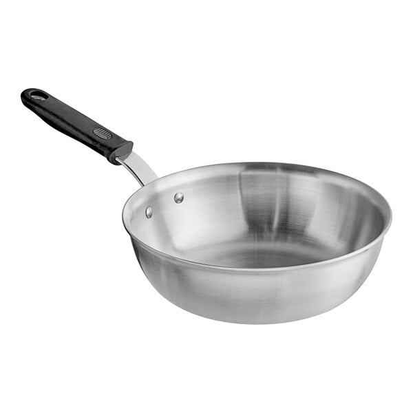 A close-up of a Vollrath stainless steel saucier pan with a black handle.
