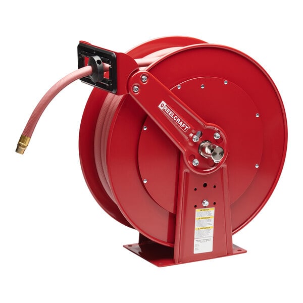 A red Reelcraft hose reel with a hose attached.