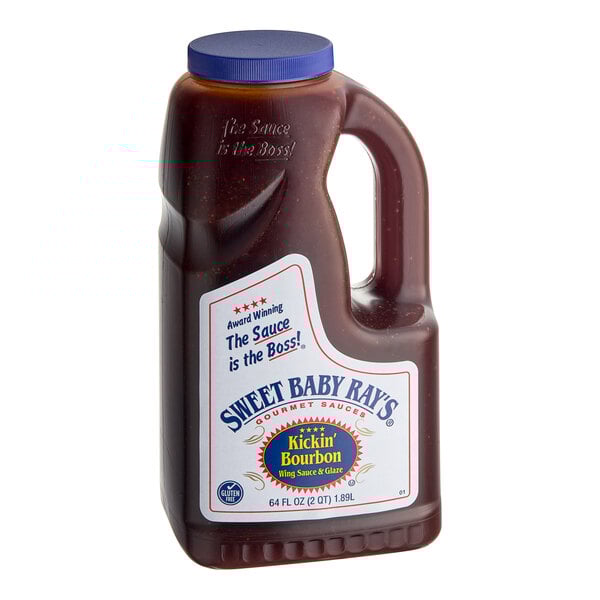 A bottle of Sweet Baby Ray's Kickin' Bourbon Wing Sauce on a table.