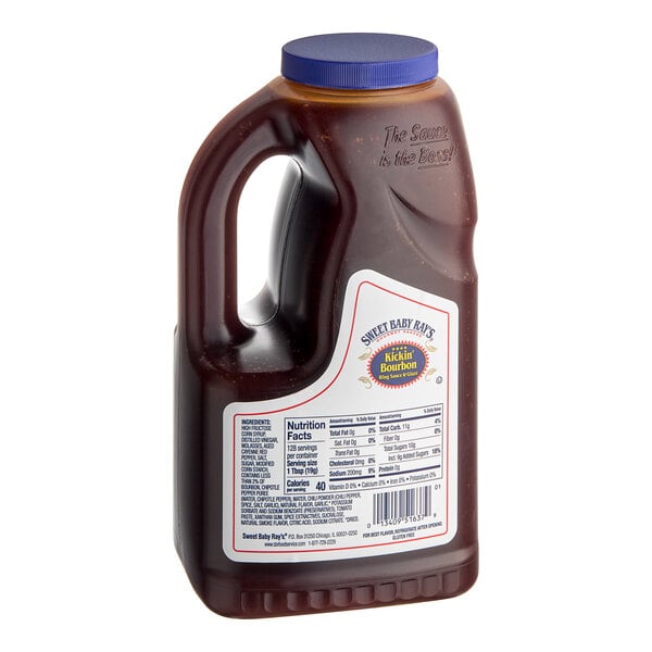 A bottle of Sweet Baby Ray's Kickin' Bourbon Wing Sauce with a blue lid.