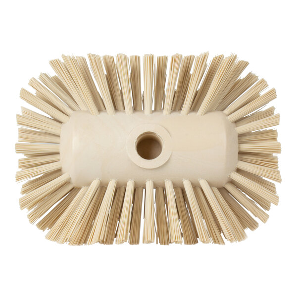 A white circular brush with tan bristles.