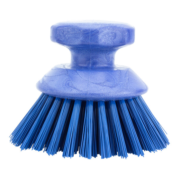 A blue round Carlisle Sparta palm scrub brush with bristles.