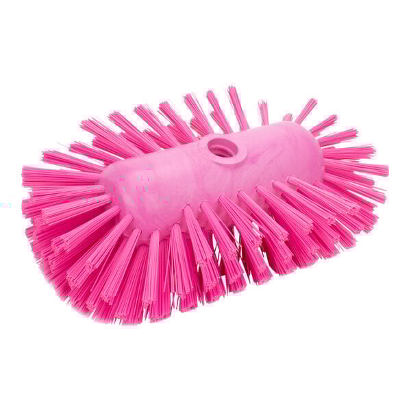 A Carlisle pink tank & kettle brush with bristles.