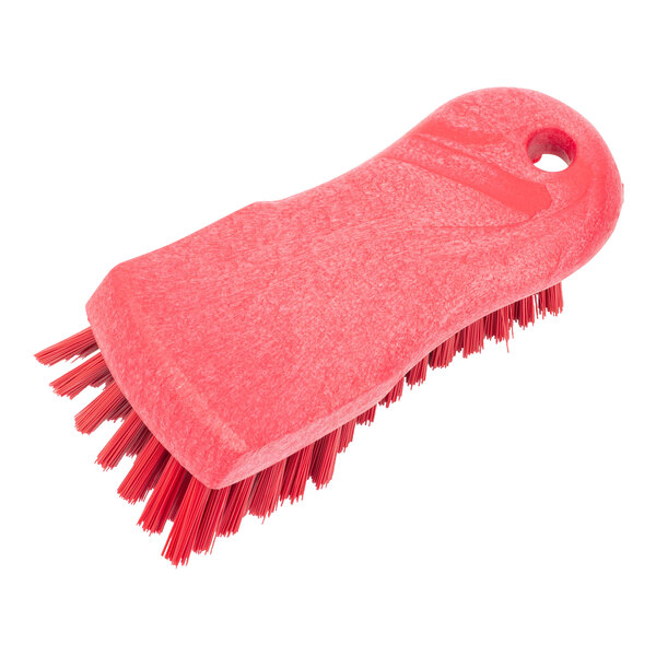 A red Carlisle Sparta handheld scrub brush with a handle.