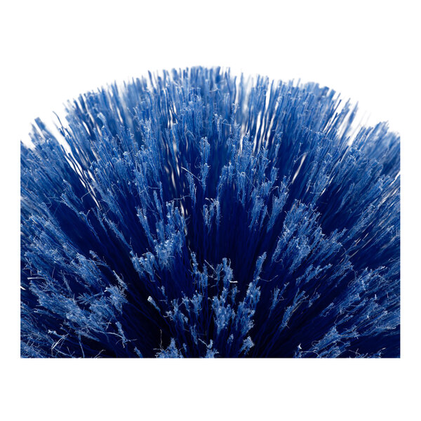 A blue corner and cobweb duster brush with dense synthetic bristles.