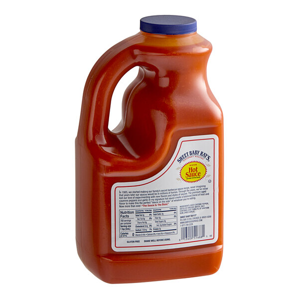 A case of four Sweet Baby Ray's Hot Sauce bottles.