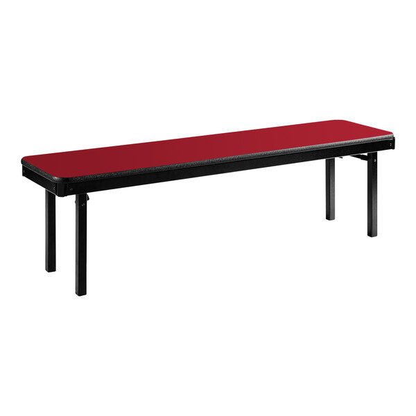 A red and black National Public Seating folding bench with a black base.