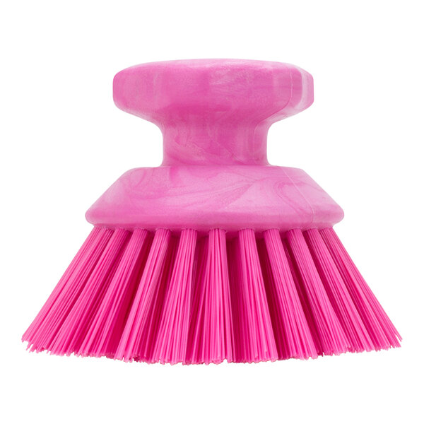 A pink Carlisle Sparta round brush with a long handle.