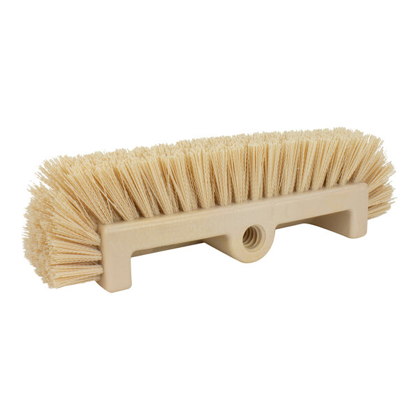 A Carlisle tan floor scrub brush with white bristles.