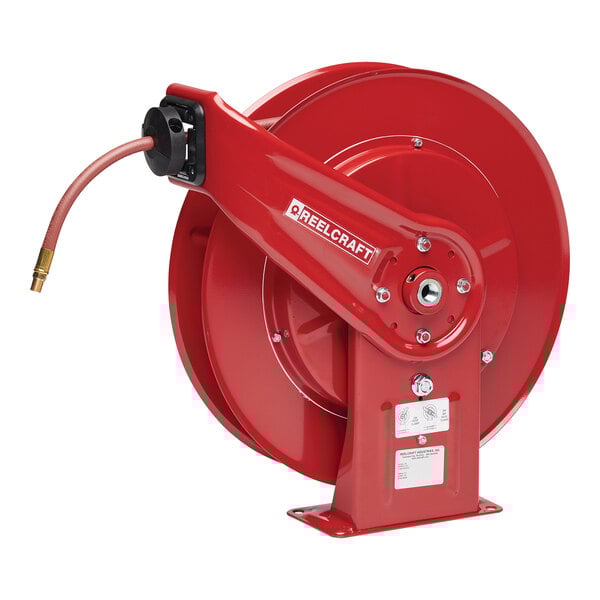 A red Reelcraft hose reel with a black handle and a hose attached.
