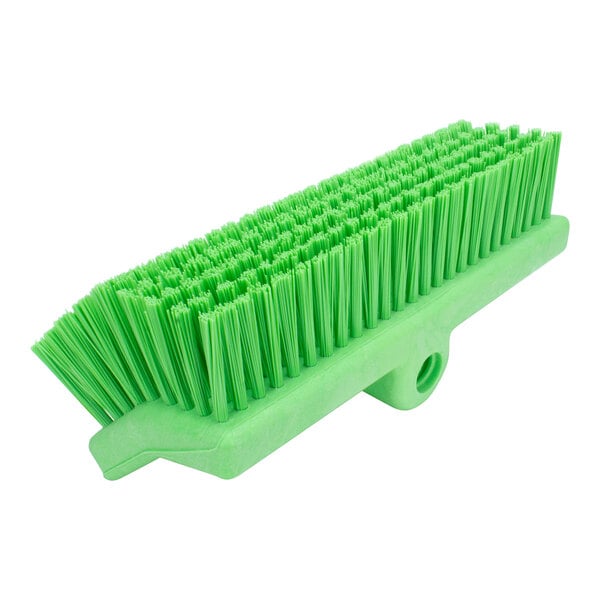 A Carlisle lime green floor scrub brush with bristles.